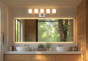 Oren 5 Light 38" Vanity in Brushed Nickel in a room setting