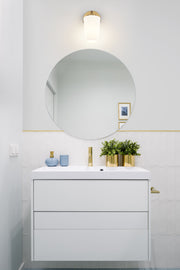 Montford 1 Light 4.5" Wall Sconce in Modern Gold in a room setting