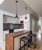 Melange 1 Light 8.25" Pendant in Matte Black in a room setting
