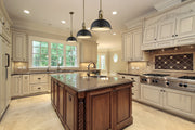 Melange 1 Light 13.25" Pendant in Bronze + Heritage Brass in a room setting
