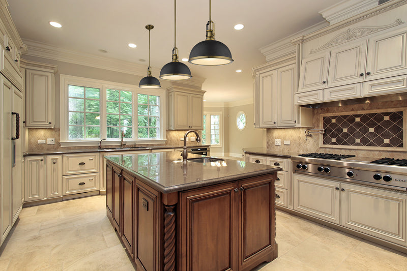 Melange 1 Light 13.25" Pendant in Bronze + Heritage Brass in a room setting