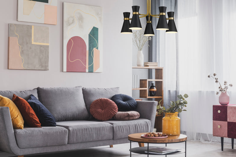 Soriano 5 Light 27" Chandelier in Matte Black + Heritage Brass in a room setting