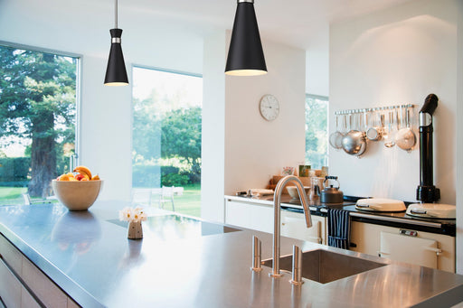 Soriano 1 Light 5.5" Pendant in Matte Black + Brushed Nickel in a room setting