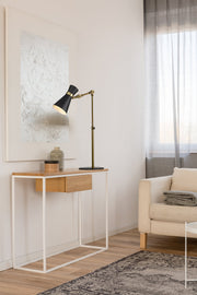 Soriano 1 Light 13.75" Table Lamp in Matte Black + Heritage Brass in a room setting