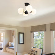 Midnetic 4 Light 18" Semi Flush Mount in Matte Black in a room setting