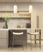 Monty 1 Light 5.25" Pendant, 17" Tall in Heritage Brass in a room setting