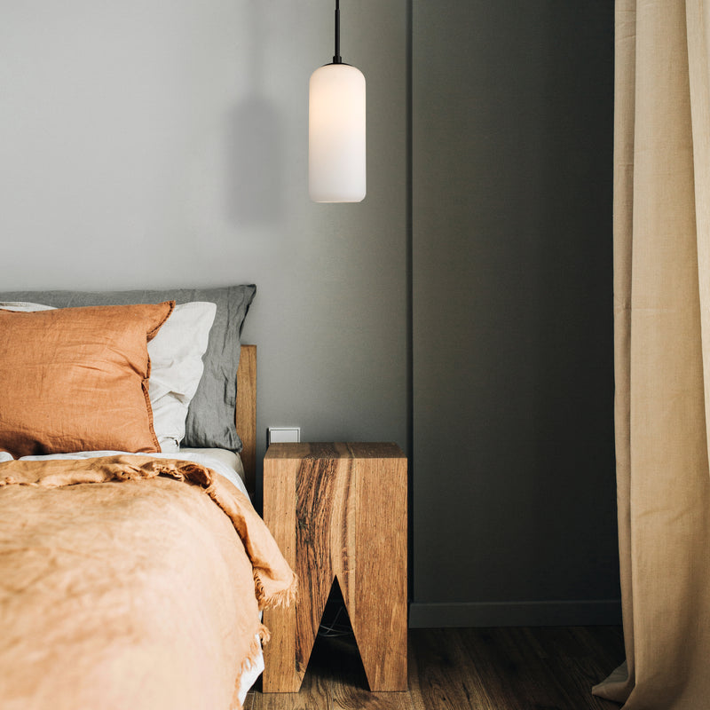 Monty 1 Light 5.25" Pendant, 17" Tall in Matte Black in a room setting