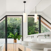 Monty 1 Light 5.25" Pendant, 22" Tall in Matte Black in a room setting