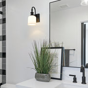 Bryant 1 Light 5.5" Wall Sconce in Matte Black in a room setting