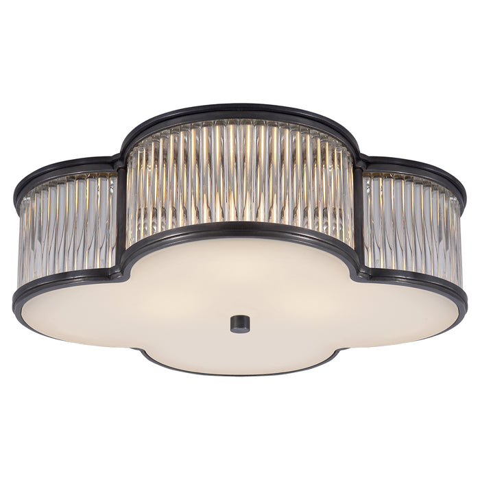 Basil Three Light Flush Mount in Gun Metal with Clear Glass