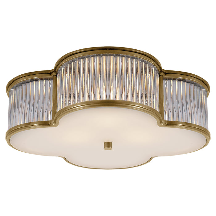 Basil Three Light Flush Mount in Natural Brass with Clear Glass