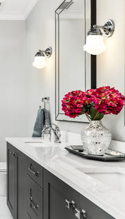 Vaughn 1 Light 6" Wall Sconce in Chrome in a room setting