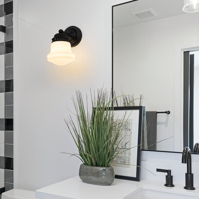 Vaughn 1 Light 6" Wall Sconce in Matte Black in a room setting