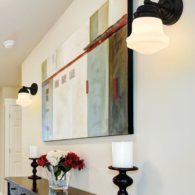 Vaughn 1 Light 6" Wall Sconce in Matte Black in a room setting
