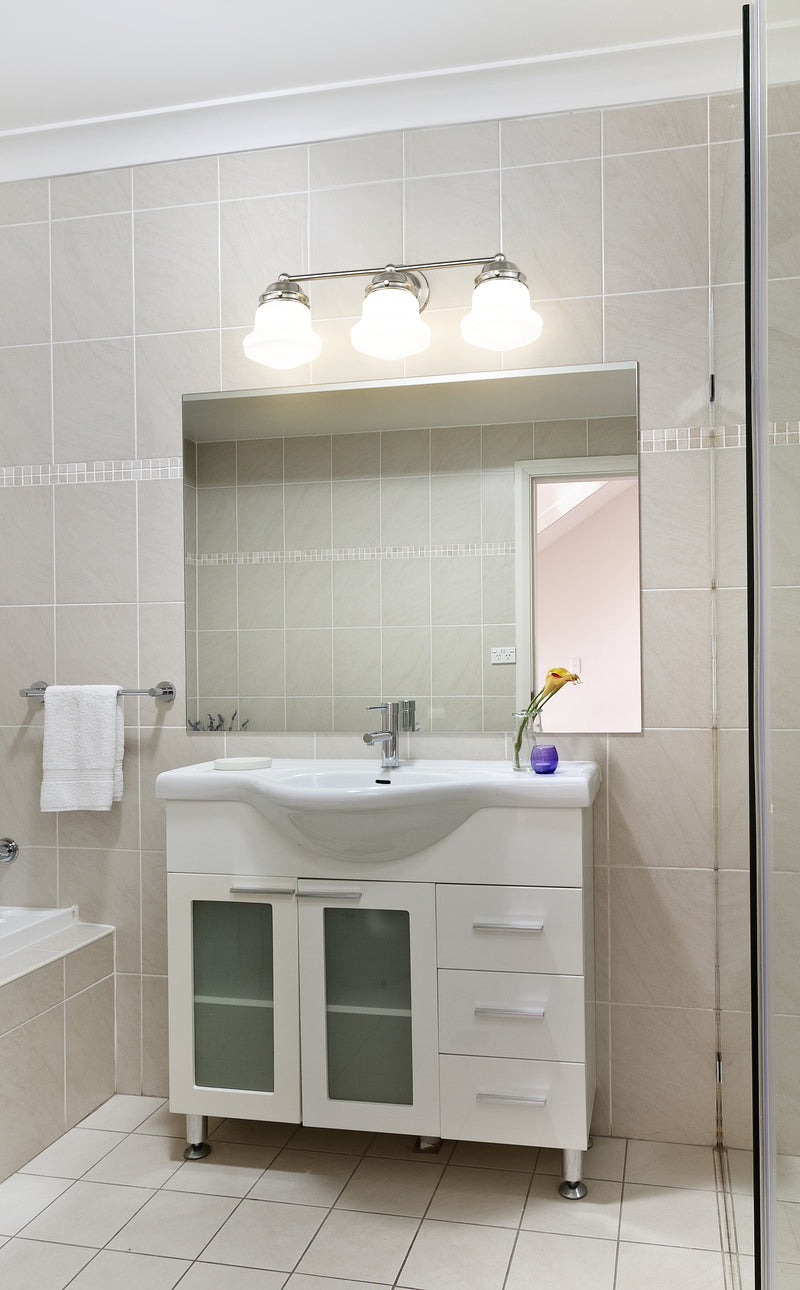 Vaughn 3 Light 22.5" Vanity in Brushed Nickel in a room setting