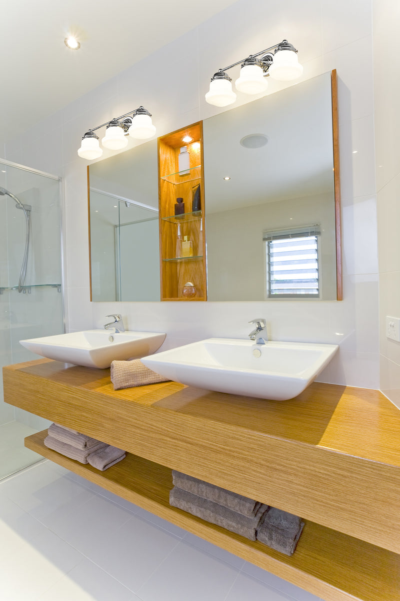 Vaughn 3 Light 22.5" Vanity in Chrome in a room setting
