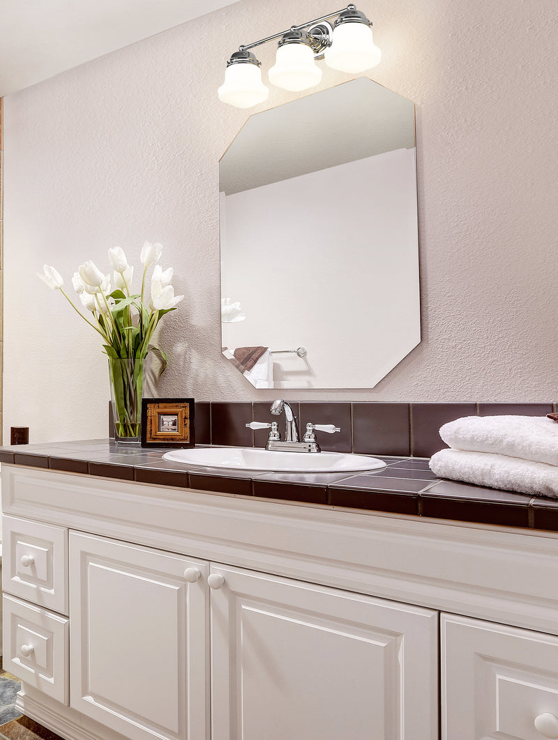 Vaughn 3 Light 22.5" Vanity in Chrome in a room setting