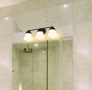 Vaughn 3 Light 22.5" Vanity in Matte Black in a room setting