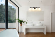 Vaughn 4 Light 31.5" Vanity in Matte Black in a room setting