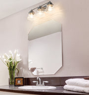 Vaughn 3 Light 22.5" Vanity in Brushed Nickel in a room setting