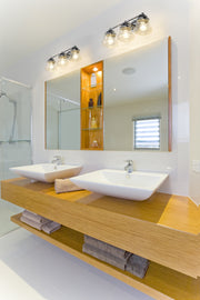 Vaughn 3 Light 22.5" Vanity in Chrome in a room setting