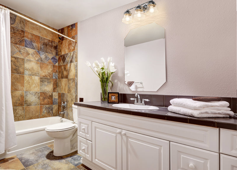 Vaughn 3 Light 22.5" Vanity in Chrome in a room setting