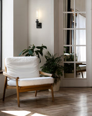 Beau 1 Light 4.5" Wall Sconce, Clear Ribbed Shade in Matte Black in a room setting