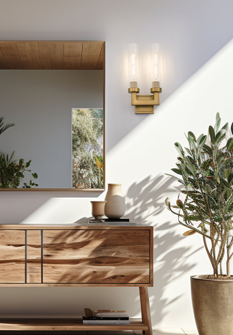 Beau 2 Light 8" Wall Sconce in Rubbed Brass in a room setting