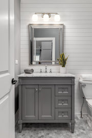 Kendrick 3 Light 23" Vanity in Brushed Nickel in a room setting