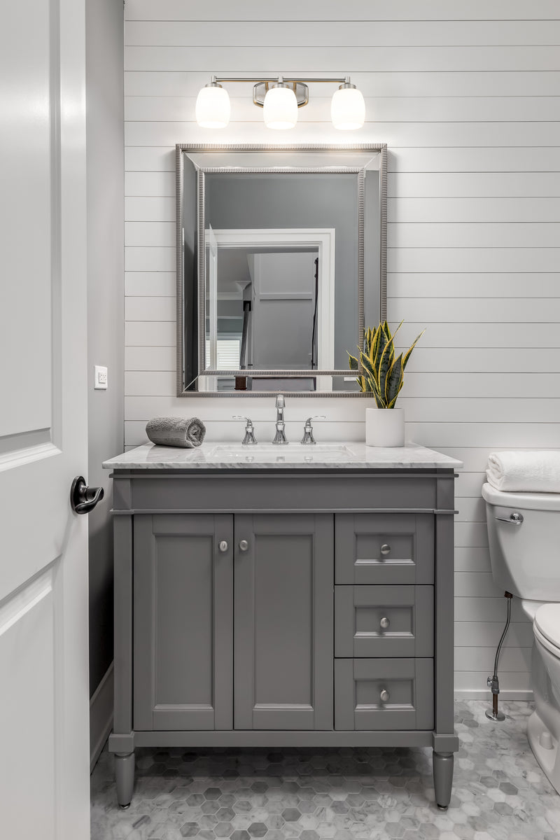Kendrick 3 Light 23" Vanity in Brushed Nickel in a room setting