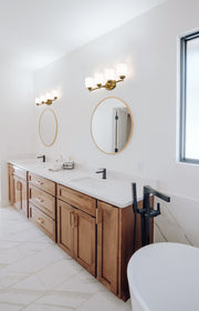 Kendrick 4 Light 31.25" Vanity in Luxe Gold in a room setting