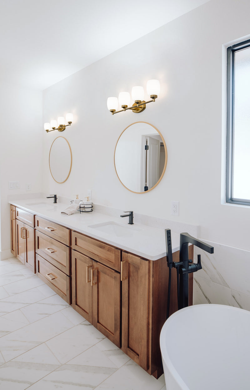 Kendrick 4 Light 31.25" Vanity in Luxe Gold in a room setting