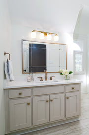 Kendrick 4 Light 31.25" Vanity in Luxe Gold in a room setting
