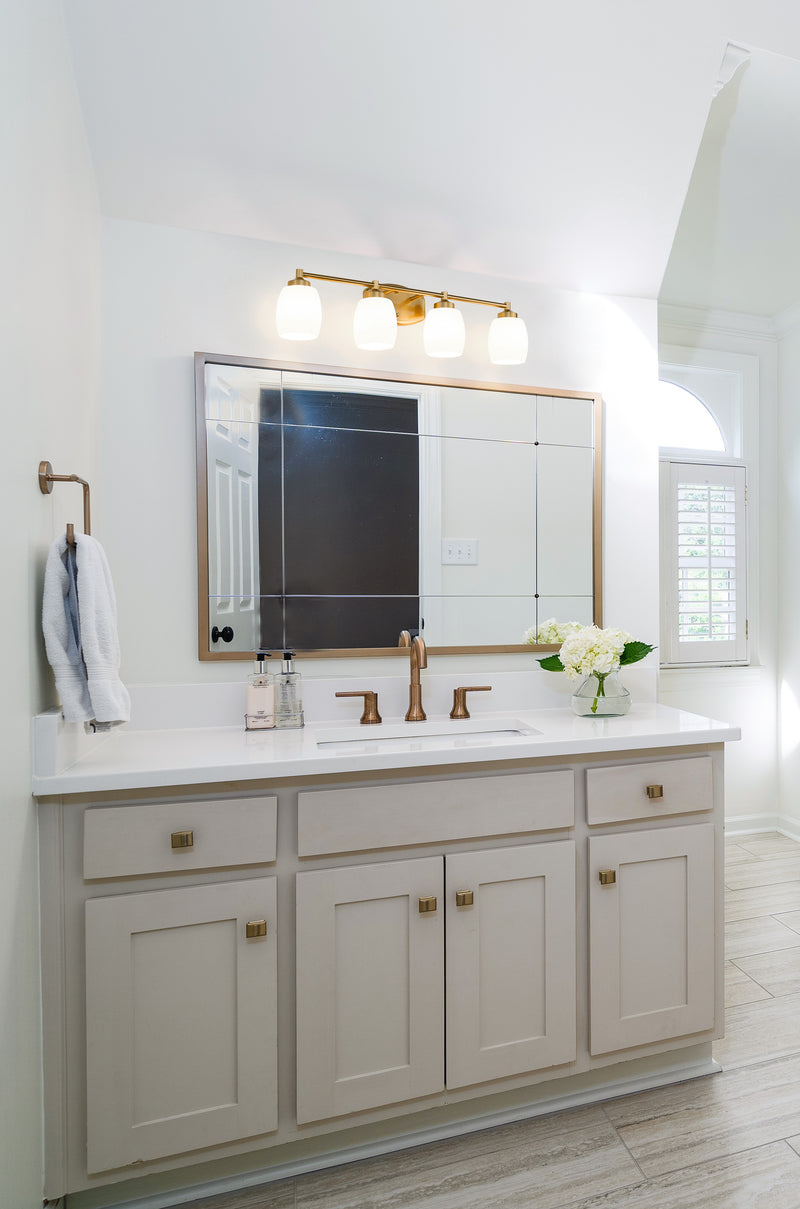 Kendrick 4 Light 31.25" Vanity in Luxe Gold in a room setting