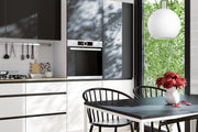 Margo 1 Light 13.75" Pendant in Brushed Nickel in a room setting