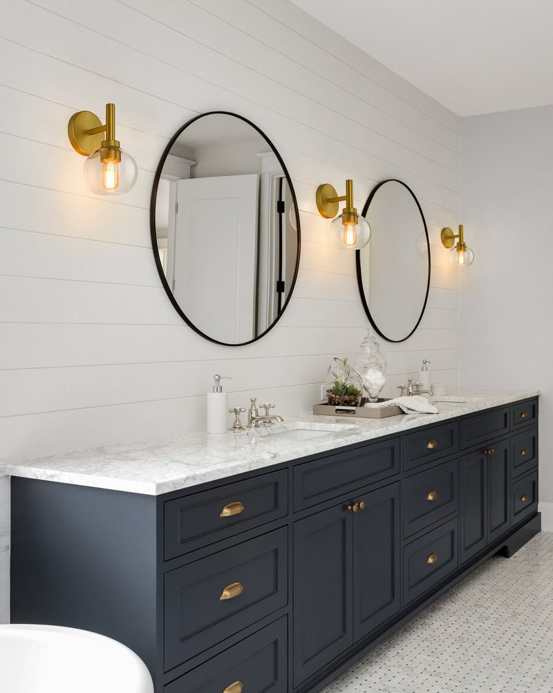 Sutton 1 Light 6" Wall Sconce in Brushed Gold in a room setting