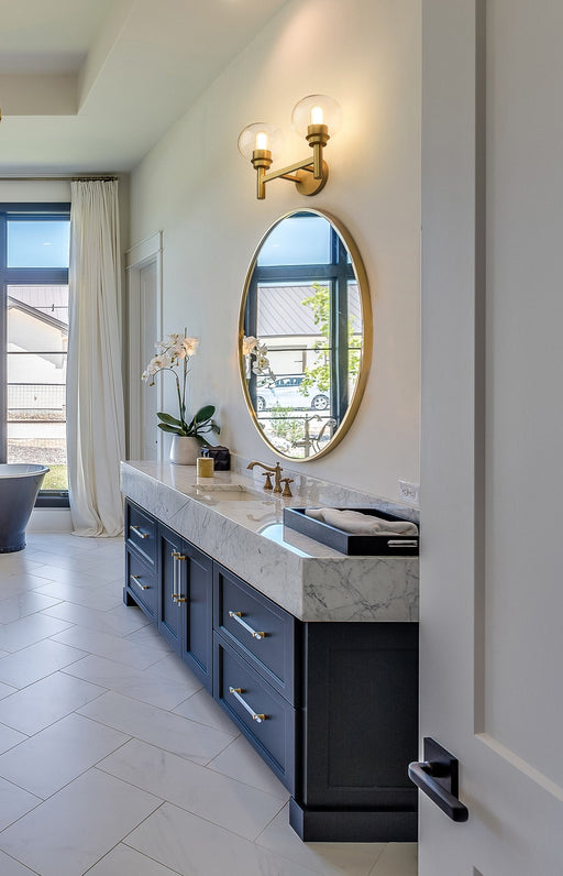 Sutton 2 Light 15.75" Vanity in Brushed Gold in a room setting