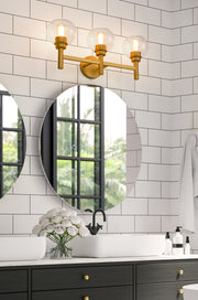 Sutton 3 Light 23.75" Vanity in Brushed Gold in a room setting