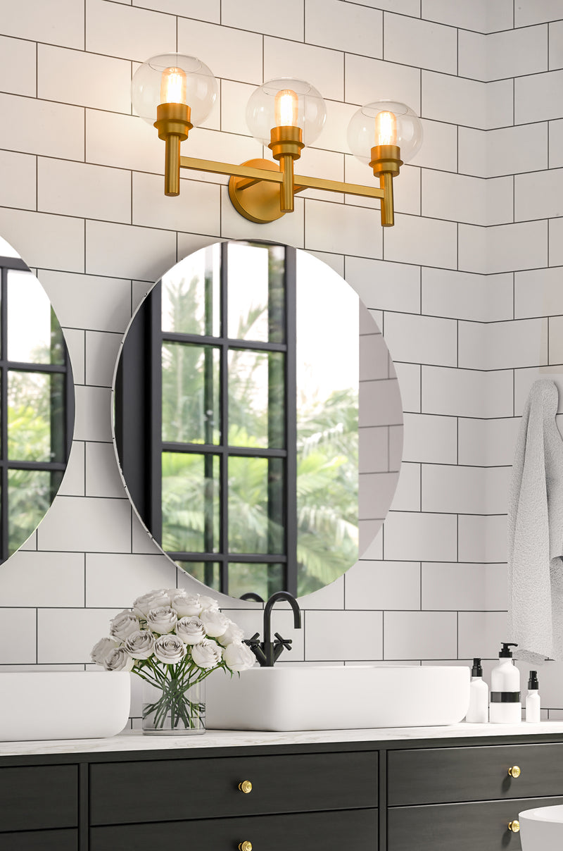 Sutton 3 Light 23.75" Vanity in Brushed Gold in a room setting