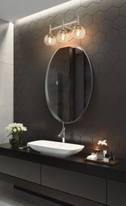 Sutton 3 Light 23.75" Vanity in Brushed Nickel in a room setting
