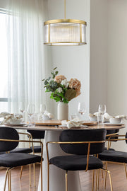 Carnaby 6 Light 24.25" Pendant in Modern Gold in a room setting