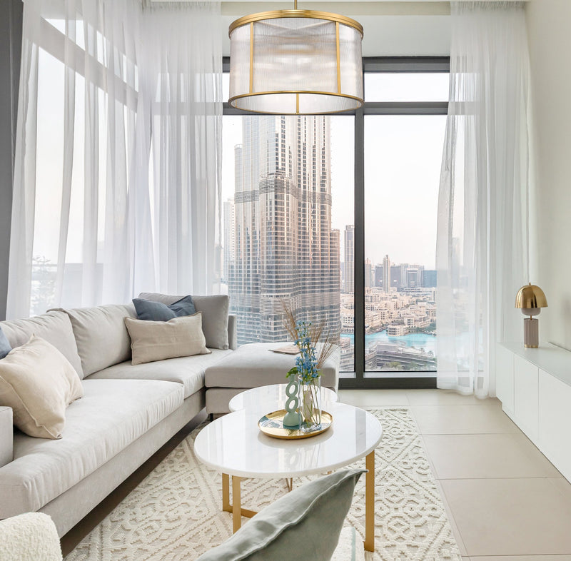 Carnaby 9 Light 32.25" Pendant in Modern Gold in a room setting
