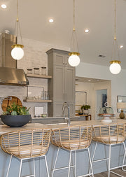 Calhoun 1 Light 9" Pendant in Heritage Brass in a room setting