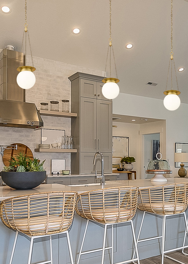 Calhoun 1 Light 9" Pendant in Heritage Brass in a room setting