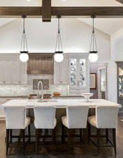 Calhoun 1 Light 9" Pendant in Matte black in a room setting