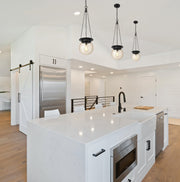 Calhoun 1 Light 9" Pendant in Matte black in a room setting