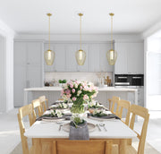 Savanti 1 Light 12" Pendant in Modern Gold in a room setting