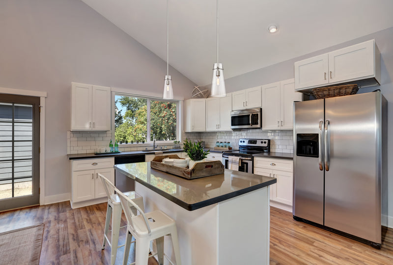 Kira 1 Light 6.5" Pendant, Rod Mount in Brushed Nickel in a room setting