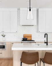 Kira 1 Light 6.5" Pendant, Rod Mount in Matte Black in a room setting