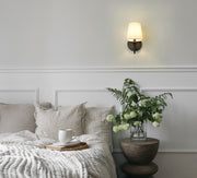 Gianna 1 Light 5.5" Wall Sconce in Matte Black in a room setting